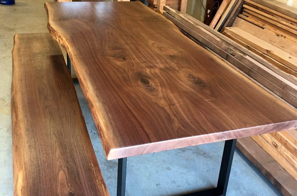Table and bench design with metal base, wooden top and live edge design Houston texas