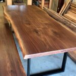 Table and bench design with metal base, wooden top and live edge design Houston texas